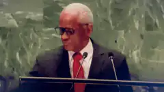 Al Roker drinks water at podium