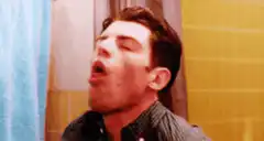 Max Carver coughing in bathroom