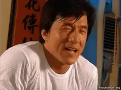 Jackie Chan grimacing in pain