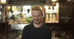 Man pours beer into glass