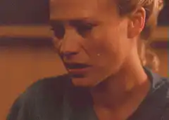 Woman crying with a tear rolling down her cheek