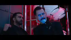 Billy Crystal as Agent M with glowing toothbrush