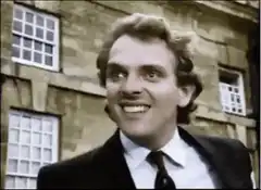 Man smiling mischievously