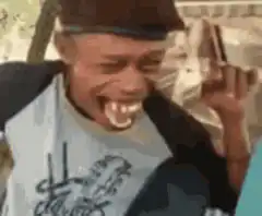 Man laughing hysterically with big teeth