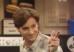 Doug Funnie winking and holding up two fingers