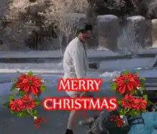 Man dancing in snow with Merry Christmas text