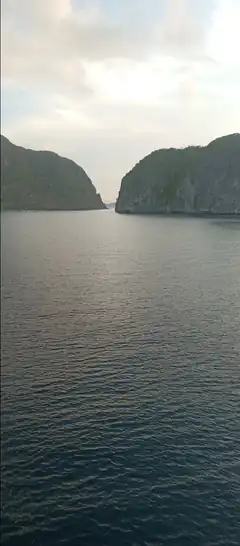calm sea between rocky cliffs