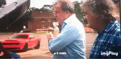 Jeremy Clarkson pointing at a red car