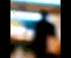 Silhouette dancing in front of TV
