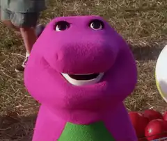 Barney the purple dinosaur smiling