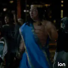 Asian man in toga dancing