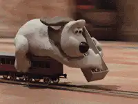 Gromit riding a train