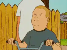 Dennis rides his bike past his dad