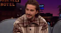 Shia LaBeouf pointing and smiling