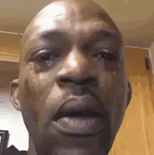 Man crying then smiling