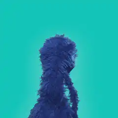 Grover turns around and welcomes Nostrich