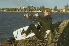 Kitesurfer pulled into water