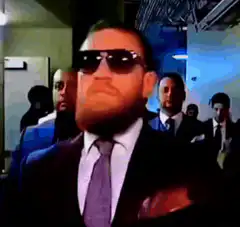 Conor McGregor walking with sunglasses