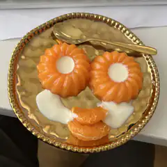 Orange dessert arranged as a face