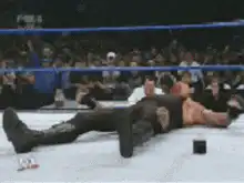 The Undertaker sits up and stares