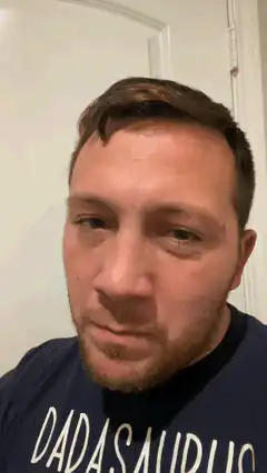 Man closes eyes and looks up