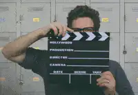 Seth Rogen claps movie clapperboard