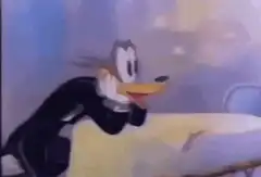 Daffy Duck gets hit by a waiter