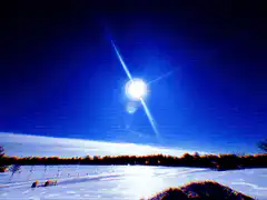 glitchy blue sky with sun