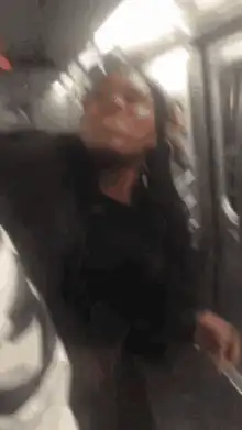 Woman on subway gets hit by swinging backpack