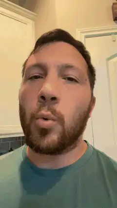 Man pursing lips and looking up