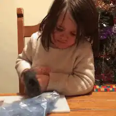 Toddler hits thumb with hammer