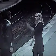 Woman slaps man on train platform