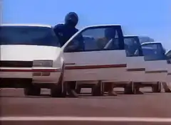 white car with doors rolling on the road