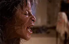 The Exorcist Regan screaming and possessed eyes