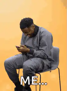 Man laughing at phone ME
