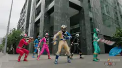 Power Rangers posing in the rain