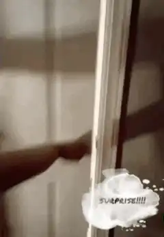 Man on toilet surprised by door opening