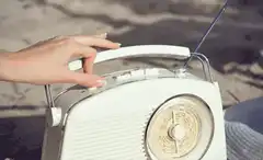 Hand adjusting vintage radio