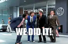 Four men jumping and celebrating WE DID IT
