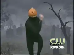 Pumpkin head dancing in graveyard