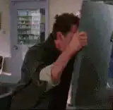 man hugs refrigerator