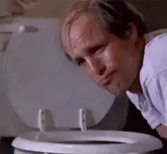 Man vomiting into toilet
