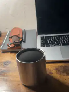 steam rising from metal cup