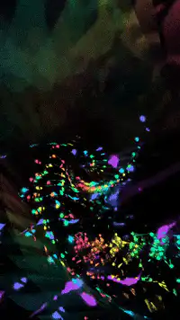 Colorful glitter swirling in a vortex
