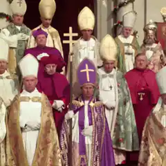 Pope bows his head in a crowd of bishops