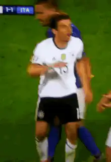 Miroslav Klose arguing with referee