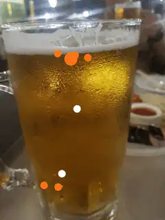 Bitcoin symbol drawn on beer glass