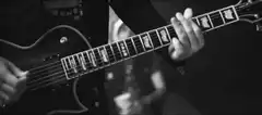 Black and white guitarist playing electric guitar