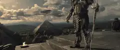 Predators standing near pyramids with ships