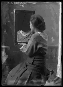 Woman looking in mirror